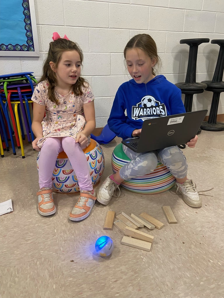 two girls working with Sphero robots